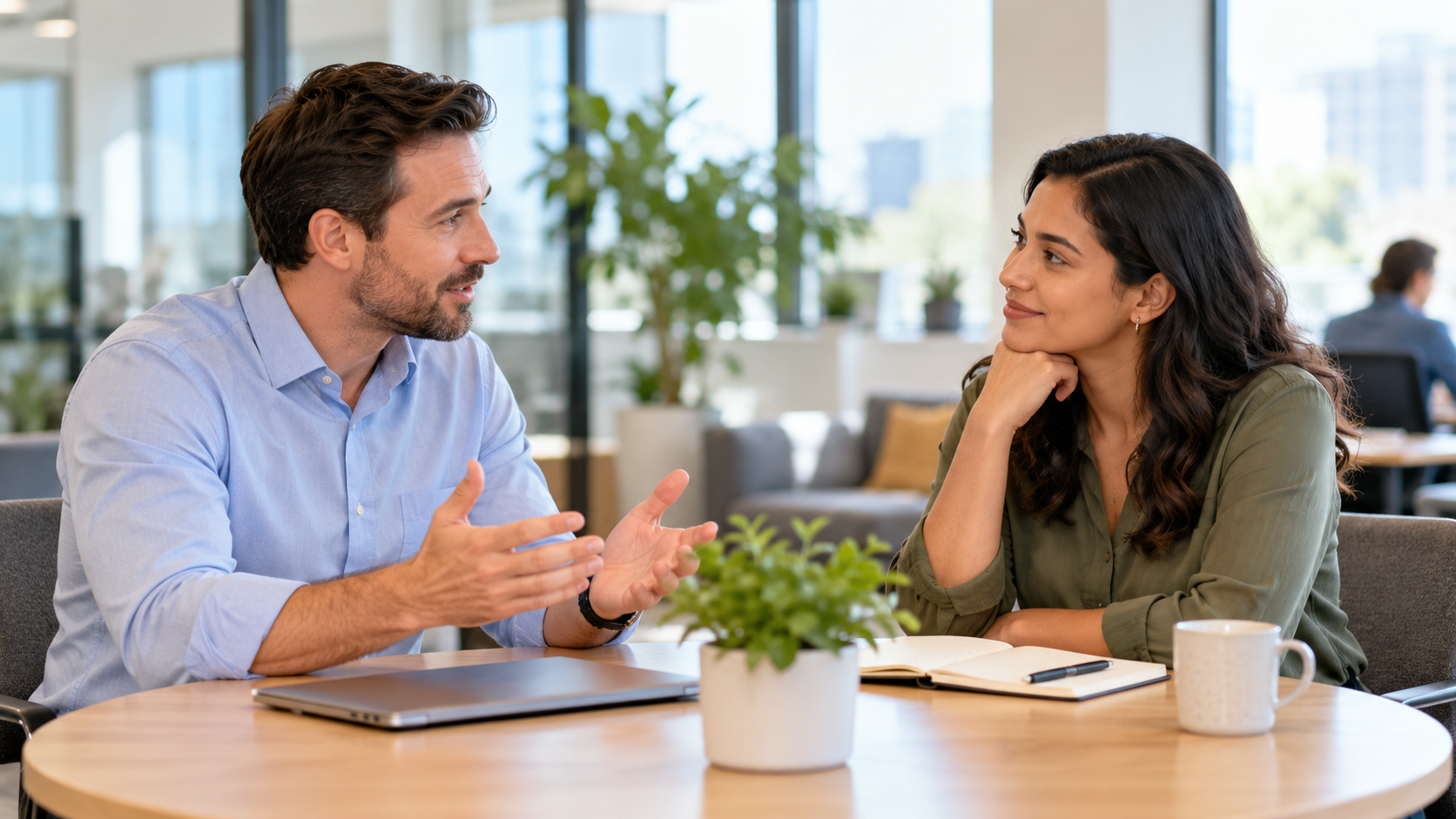 Two coworkers having a supportive feedback conversation
